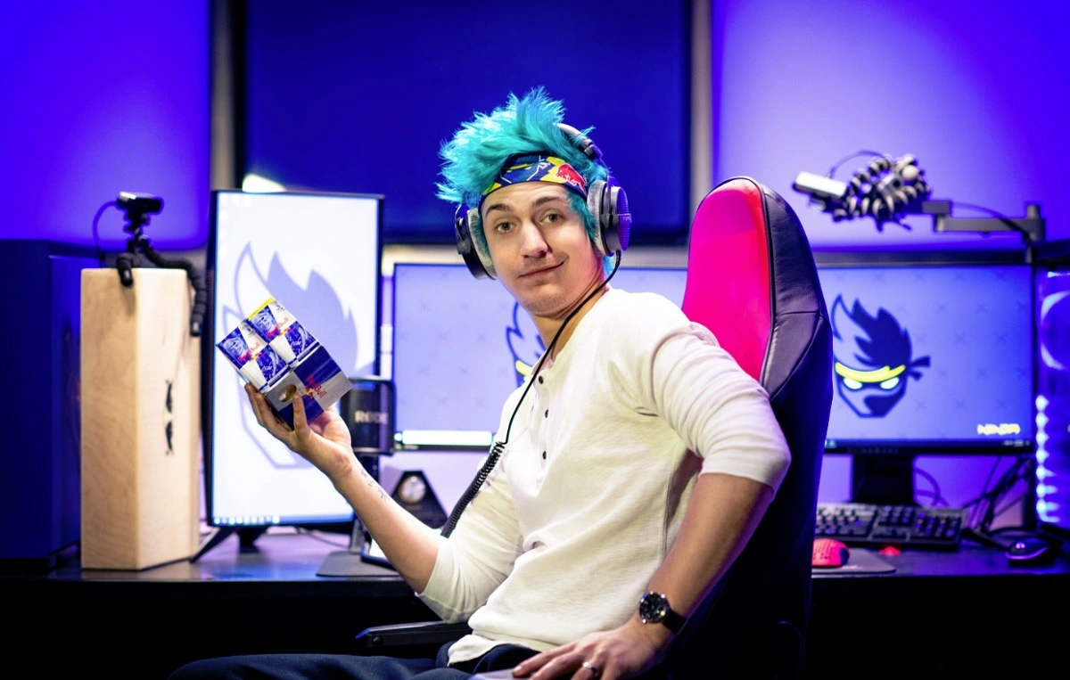 Ninja posing with a 4 can redbull pack